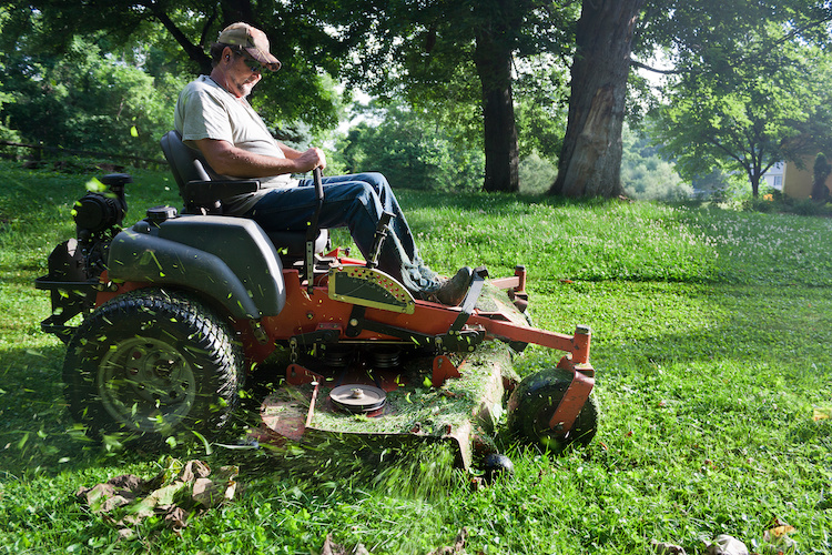 exhausted man mowing lawn industry burnout
