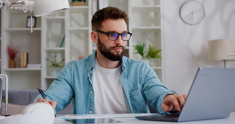 lawn maintenance professional on laptop